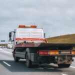 Empty,Tow,Truck,With,Drives,Down,A,Highway